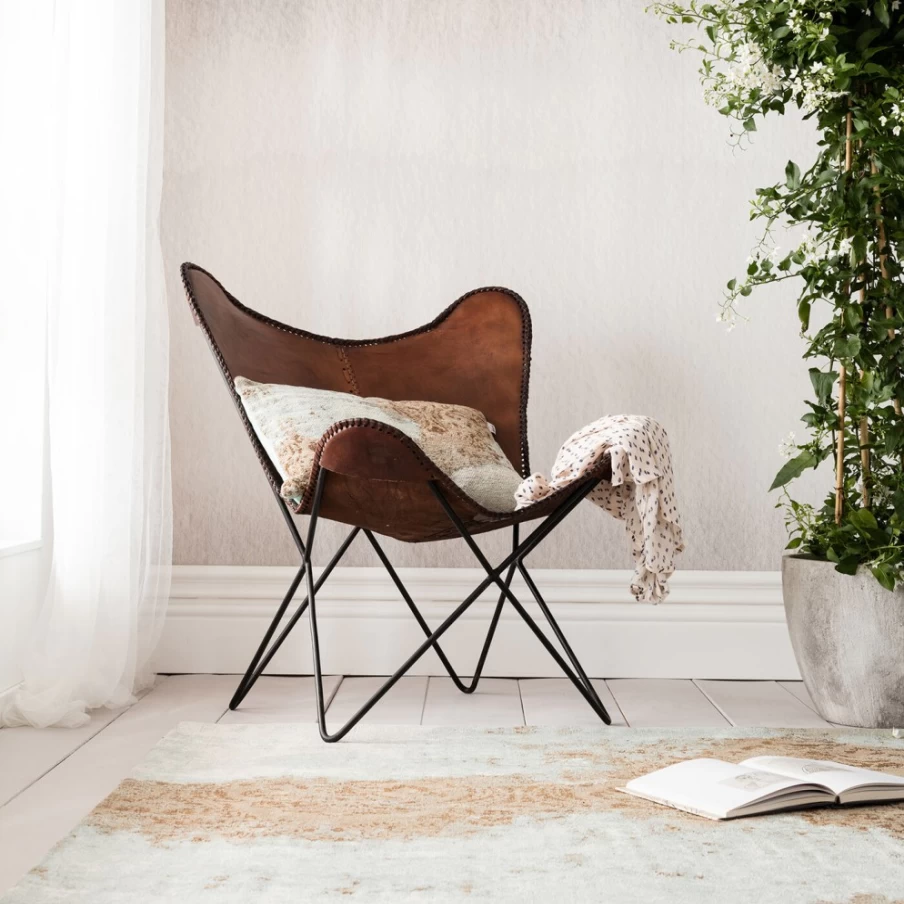 "KARE Design Modern Butterfly Armchair in Rich Brown – Stylish Lounge Chair for Living Room"
